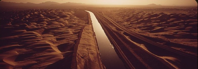 The All American Canal carries Colorado River water through sand swept area of the Imperial Valley