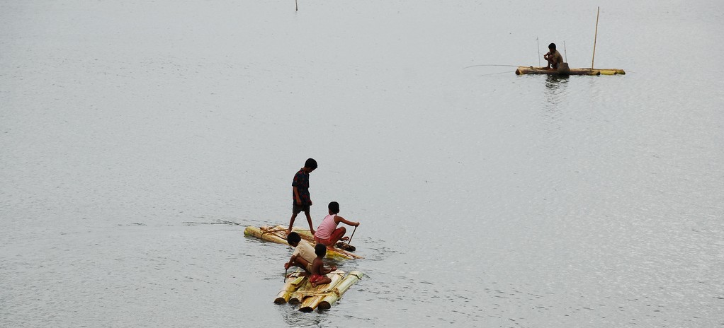 People on rafts in open water, Bangladesh