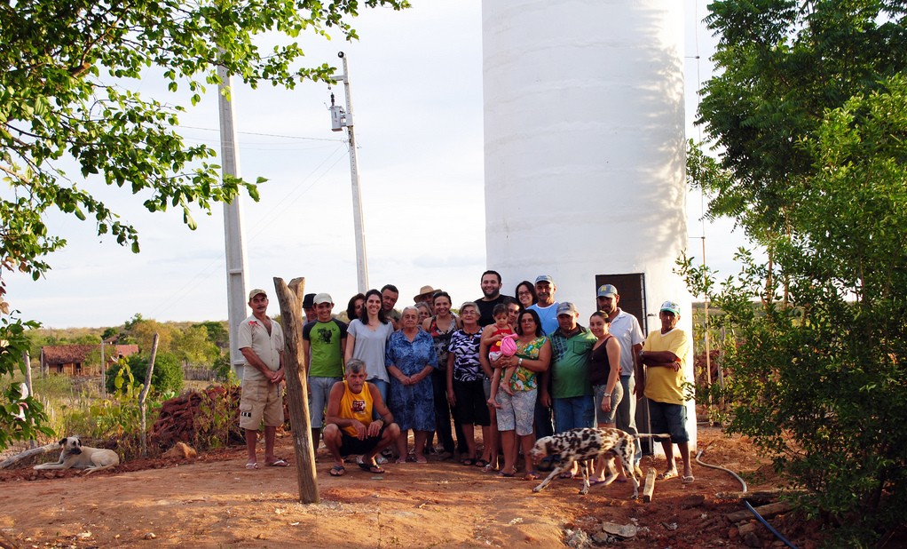 Water tower with local residents, Milha, Brazil