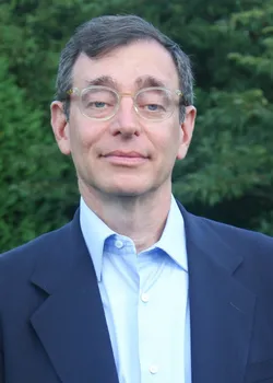 Seth Siegel headshot on green background
