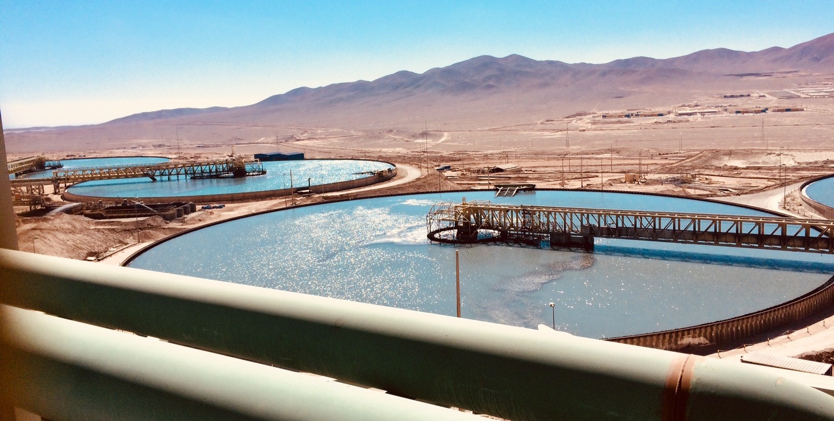 Open mining pools in desert landscape